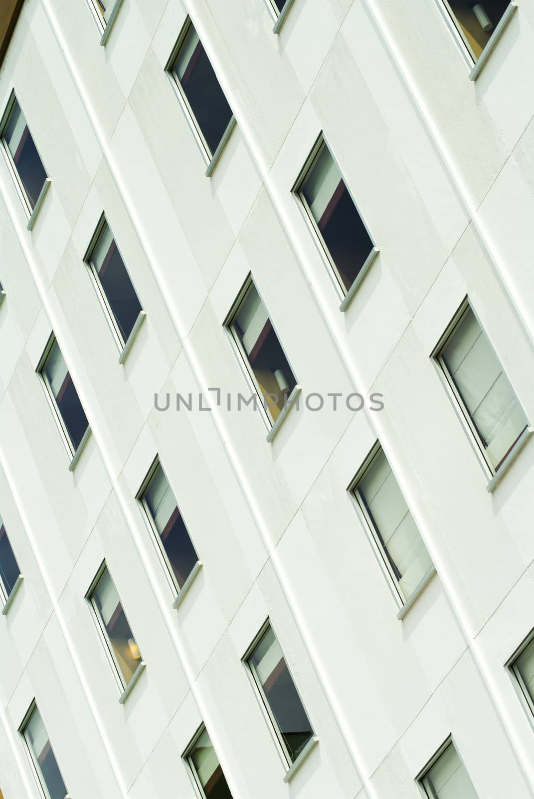 Facade of a modern office building with symmetric glass windows