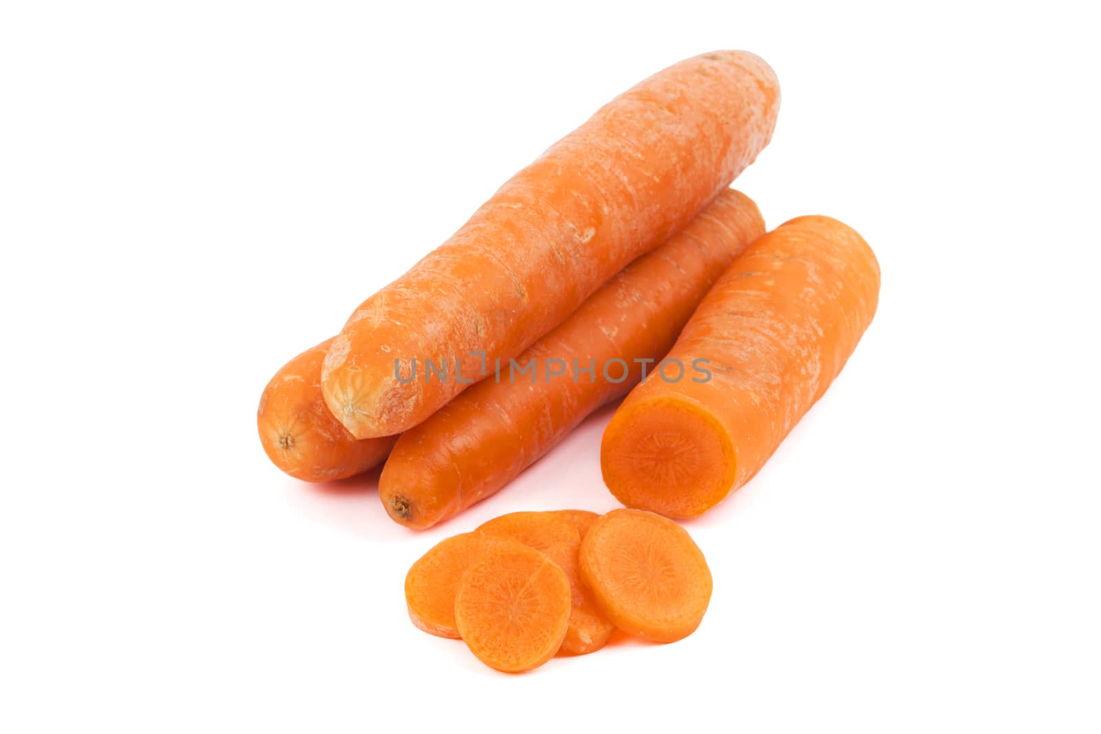 Fresh carrots with slices on a white background