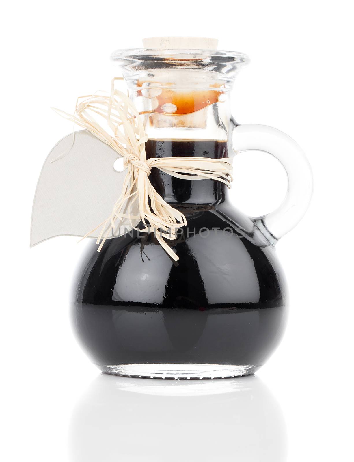 maple syrup in glass bottle or herbal syrup, ardent drink, mixture, with heart label. on white background.