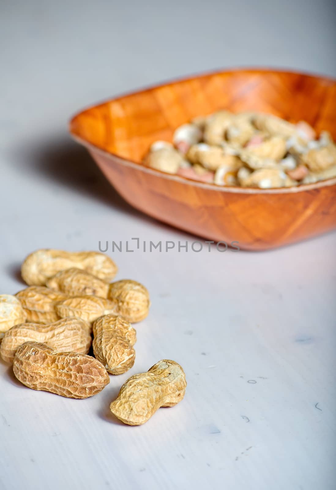 Peanuts in a brown bowl