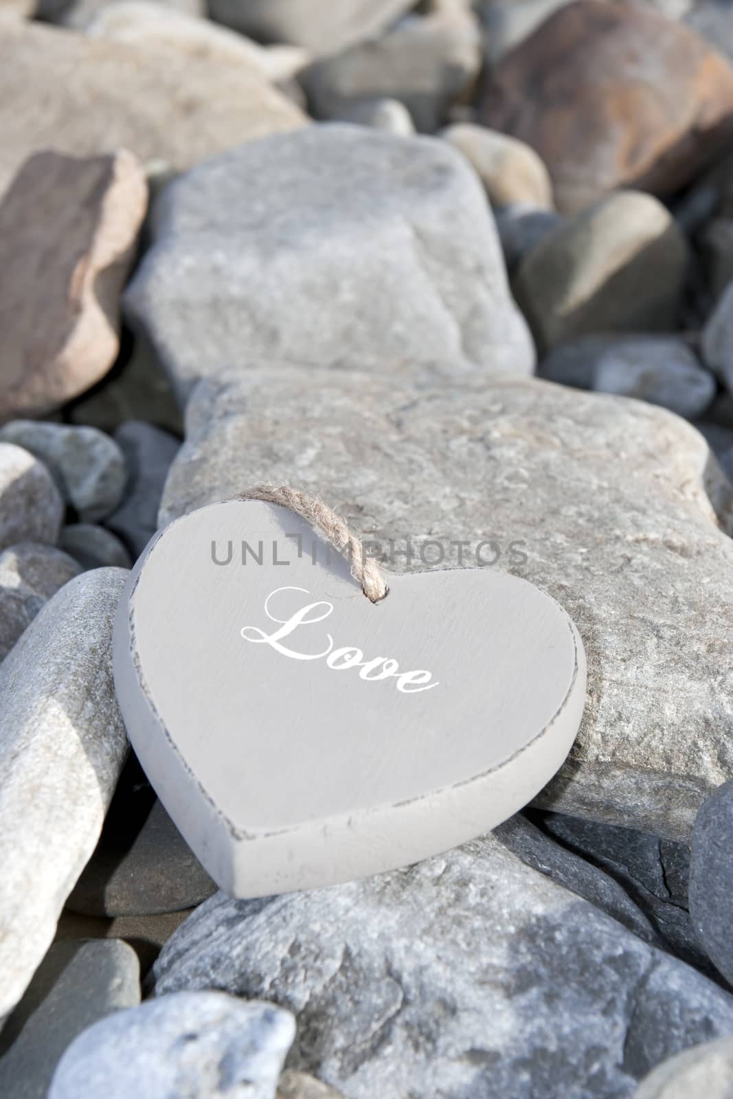 inscribed love heart on the rocks by morrbyte