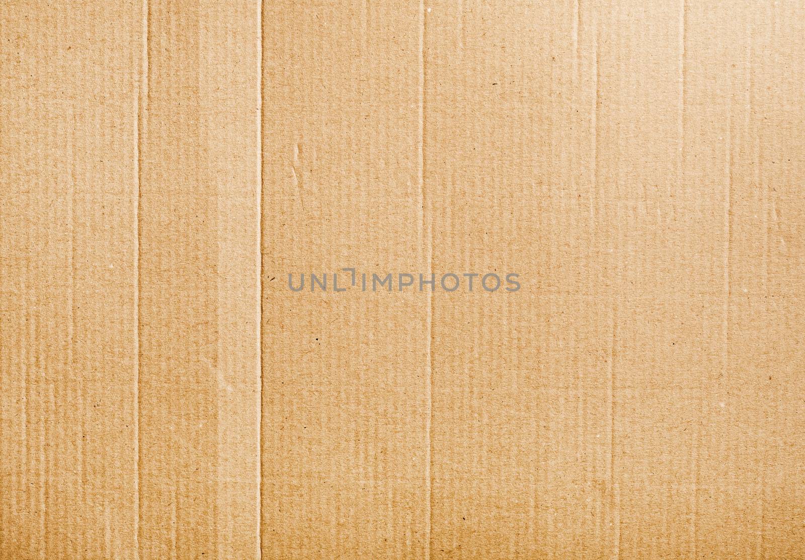 Corrugated cardboard background texture with some wrinkles 