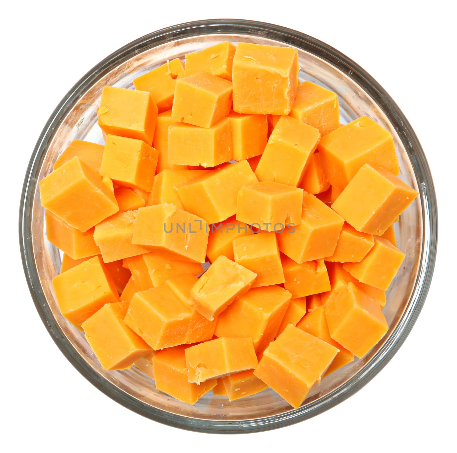 Top View Diced Cheddar Cheese Squares in Bowl Over White