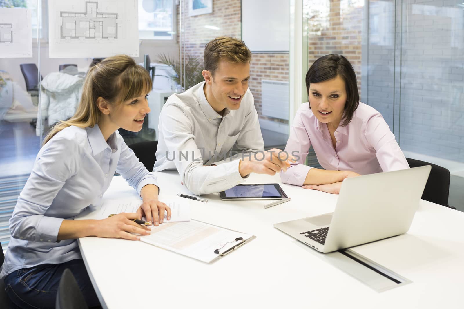 Businesswoman businessman reunion computer desk colleagues