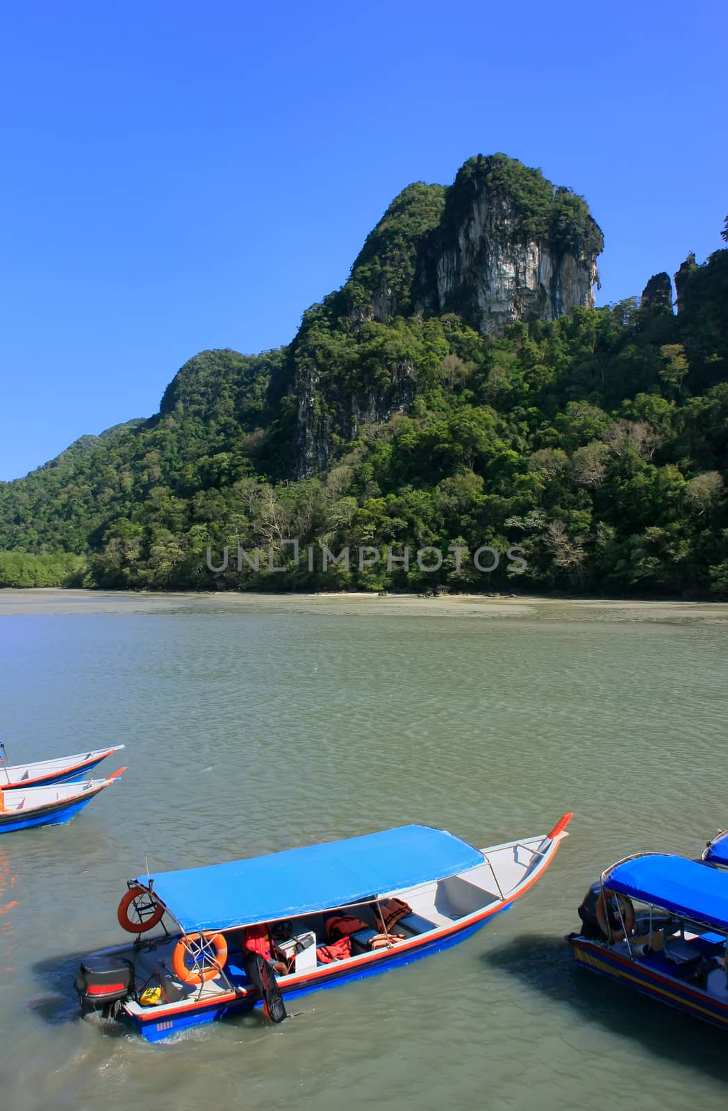 Tourist boats at Island of the Pregnant Maiden lake, Marble Geoforest Park, Langkawi, Malaysia