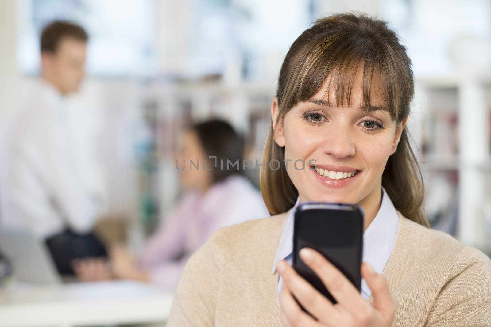 Female business cell phone desk typing