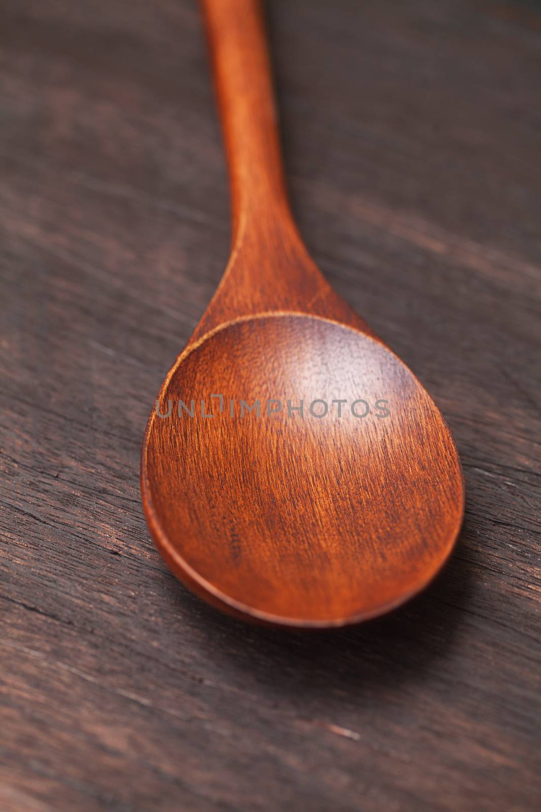 wooden spoon on a wooden surface by jannyjus