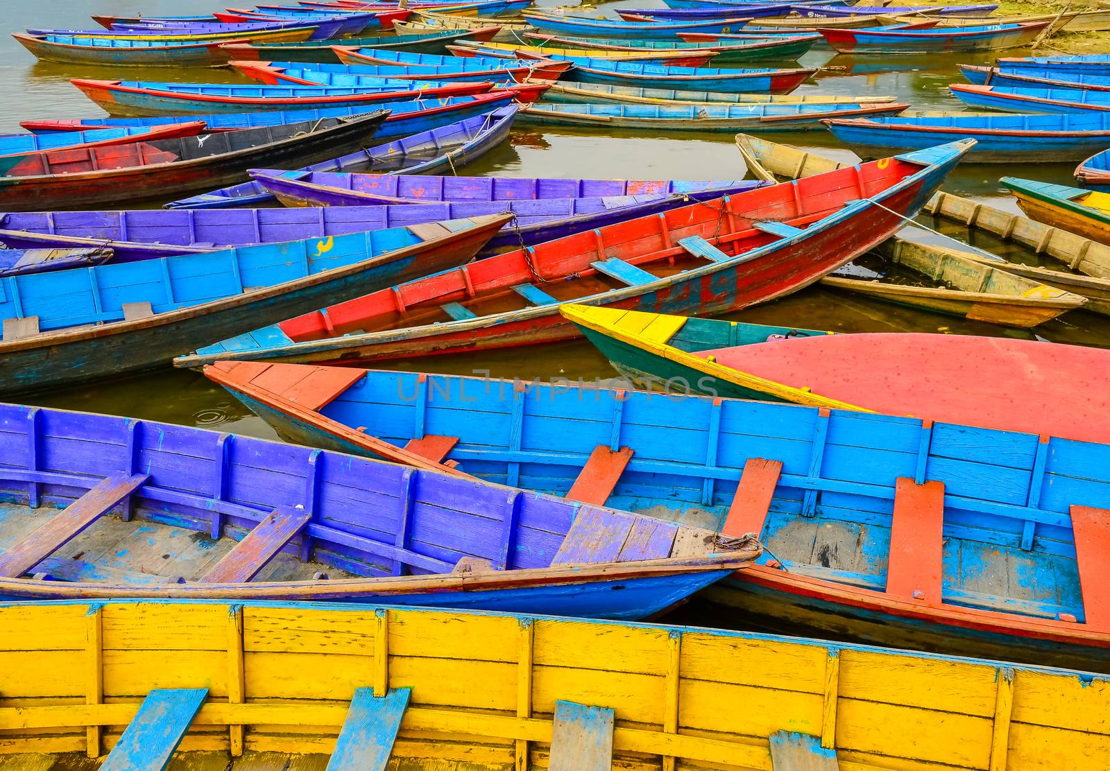 Detail of old colorful sail boats in the lake, Pokhara, Nepal