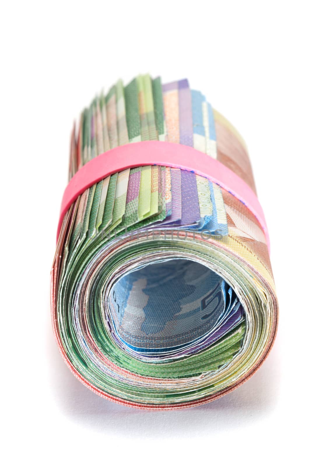 Front view of a Roll of Canadian banknotes wraped with a pink rubber band