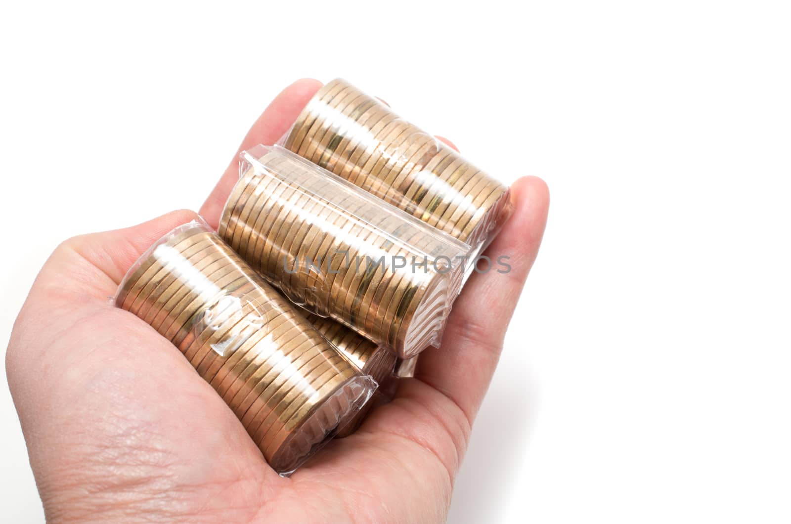 Male Asian hand holding a bunch of one dollar coins by daoleduc
