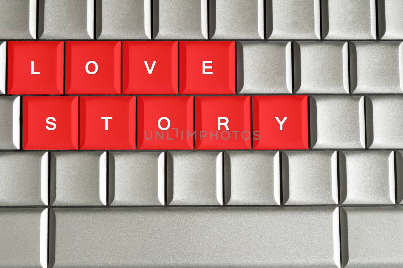 Love story  spelled on metallic keyboard