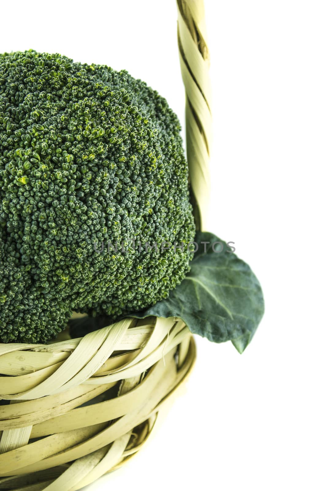 Fresh broccoli in Straw basket on white background.