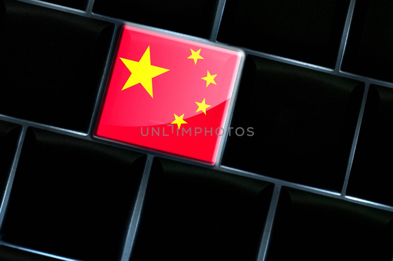 Chinese online concept with flag over the backlit keyboard