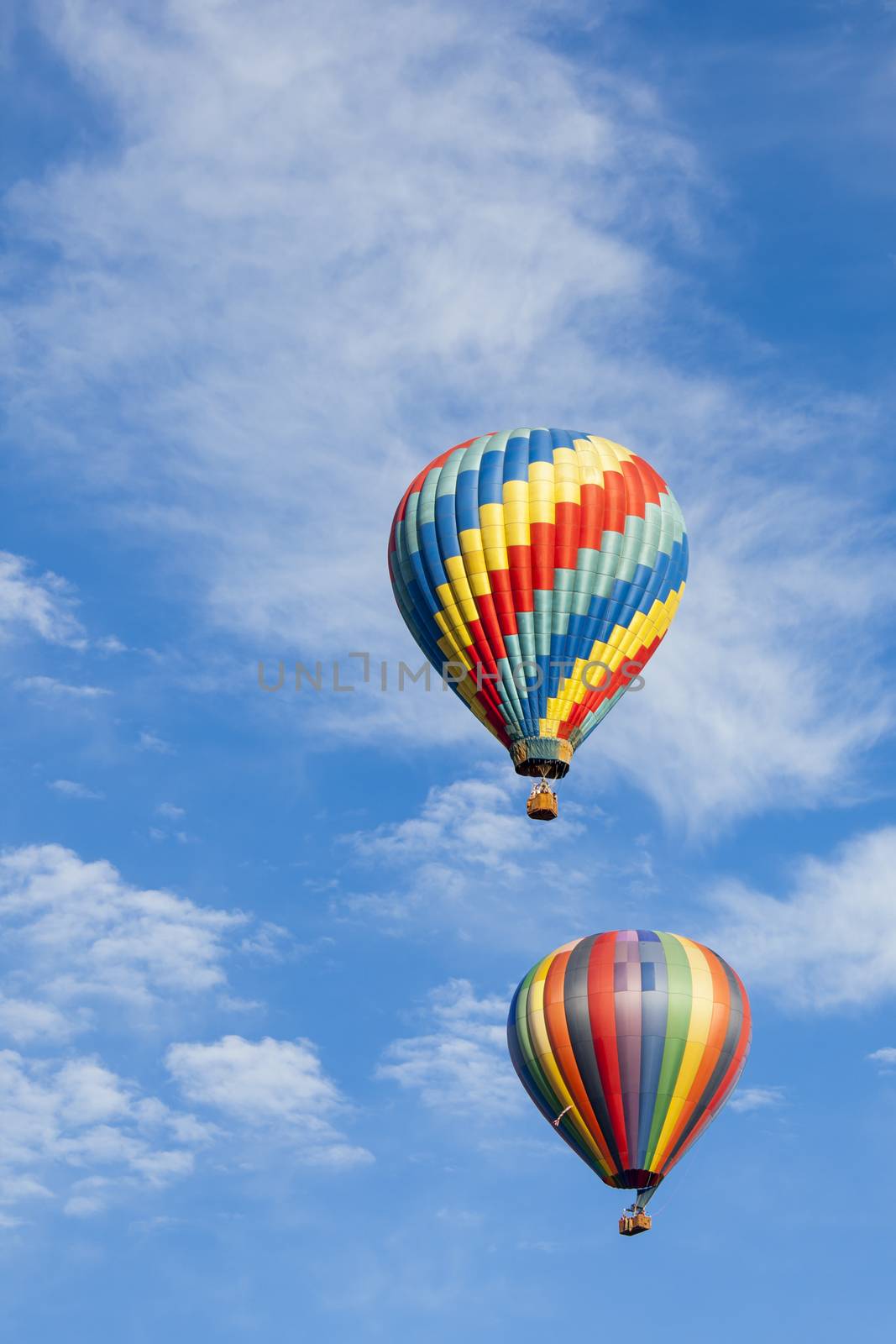 Beautiful Hot Air Balloons Against a Deep Blue Sky and Clouds.