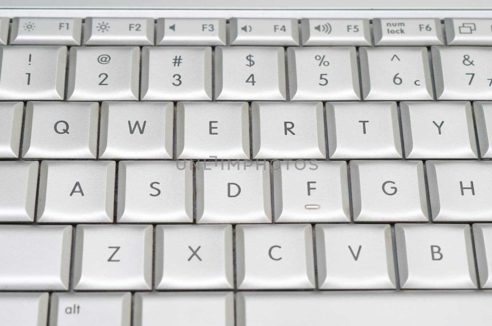 qwerty on laptop metallic keyboard 