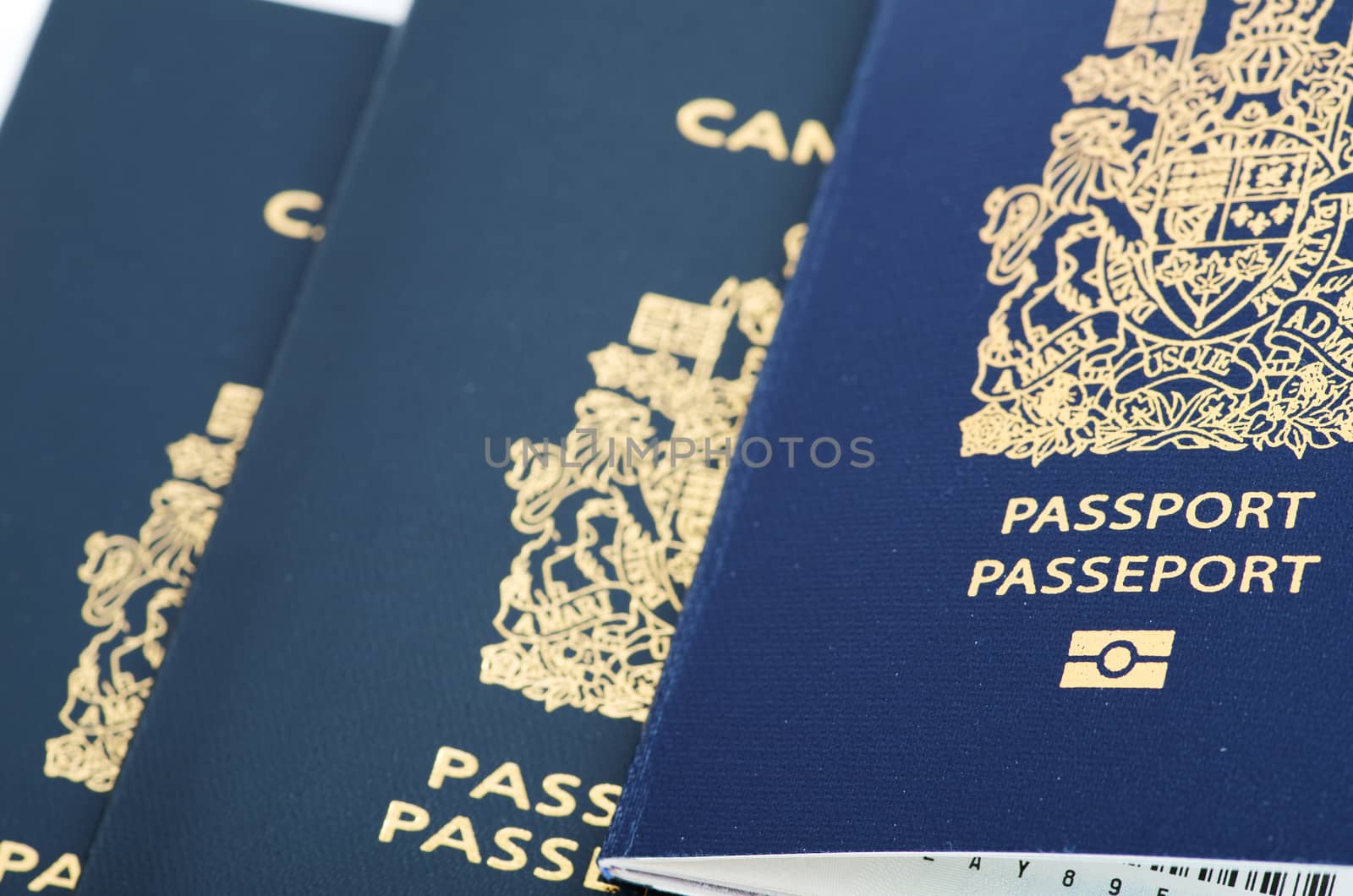 THree Canadian passports, two old and one new for child on top