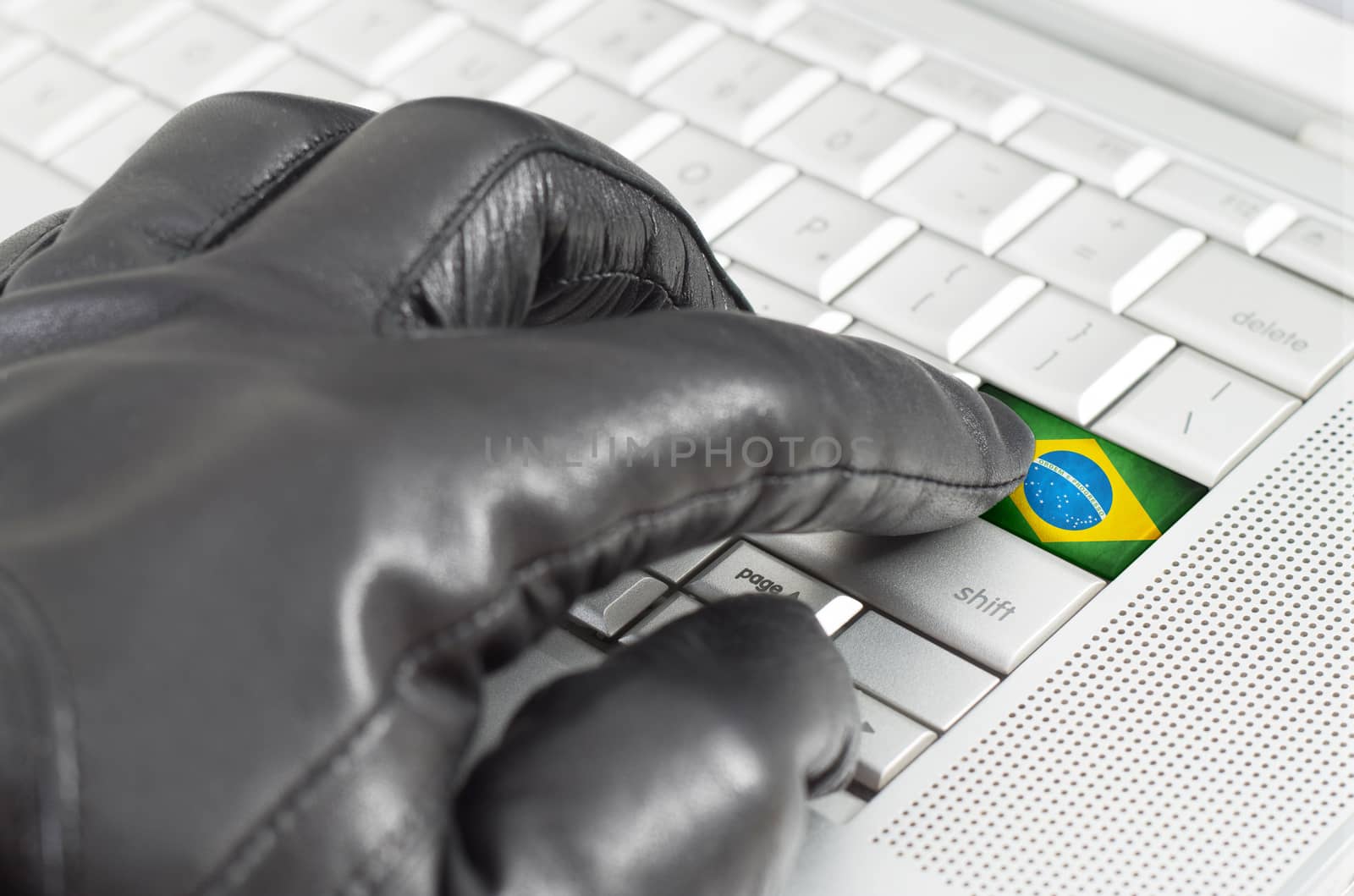 Hacking Brazil concept with hand wearing black leather glove pre by daoleduc