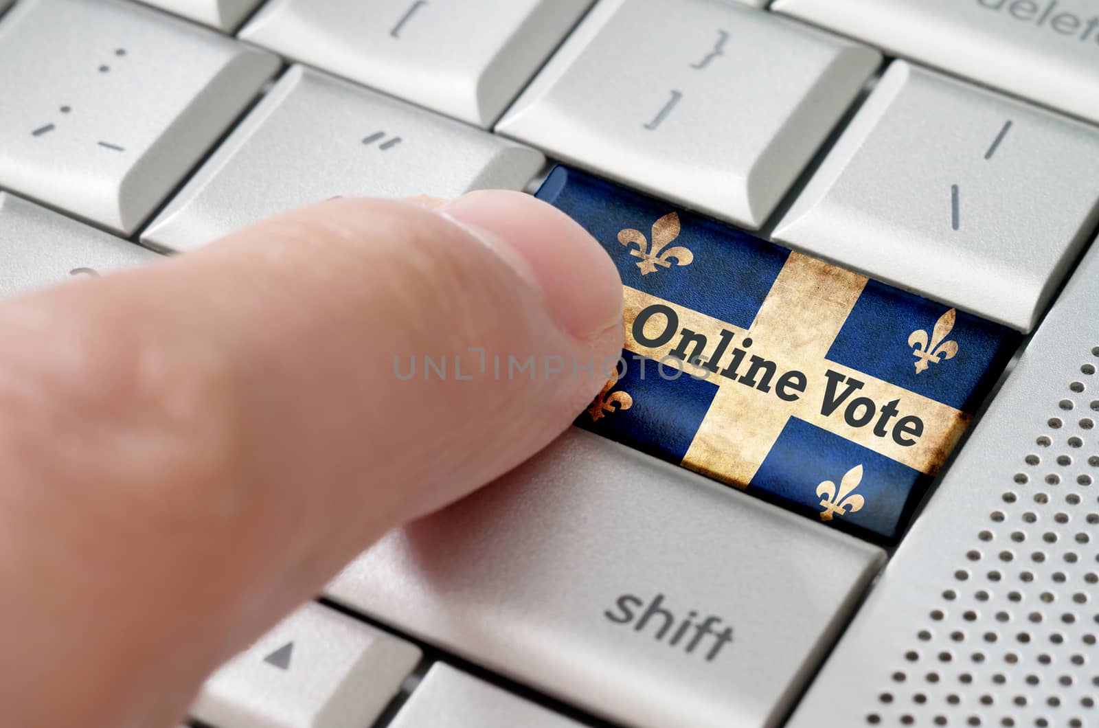 Quebec online voting concept on metallic keyboard