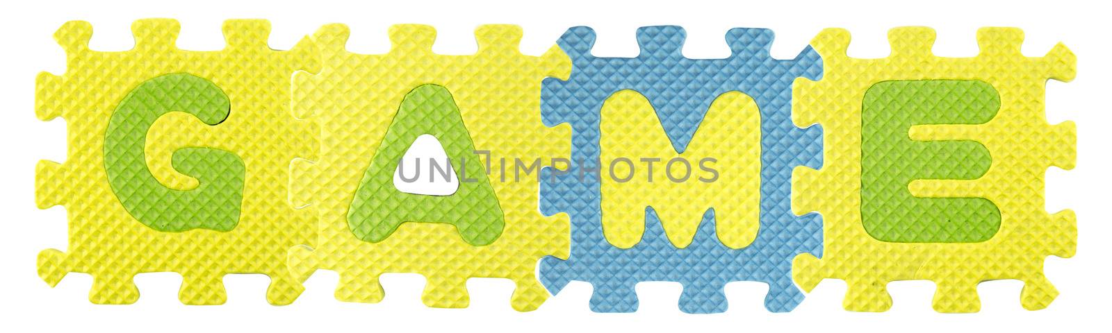 Game word created from Alphabet puzzle isloated on white background , with clipping path.