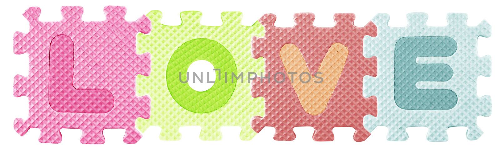 Love word created from Alphabet puzzle isloated on white background , with clipping path.