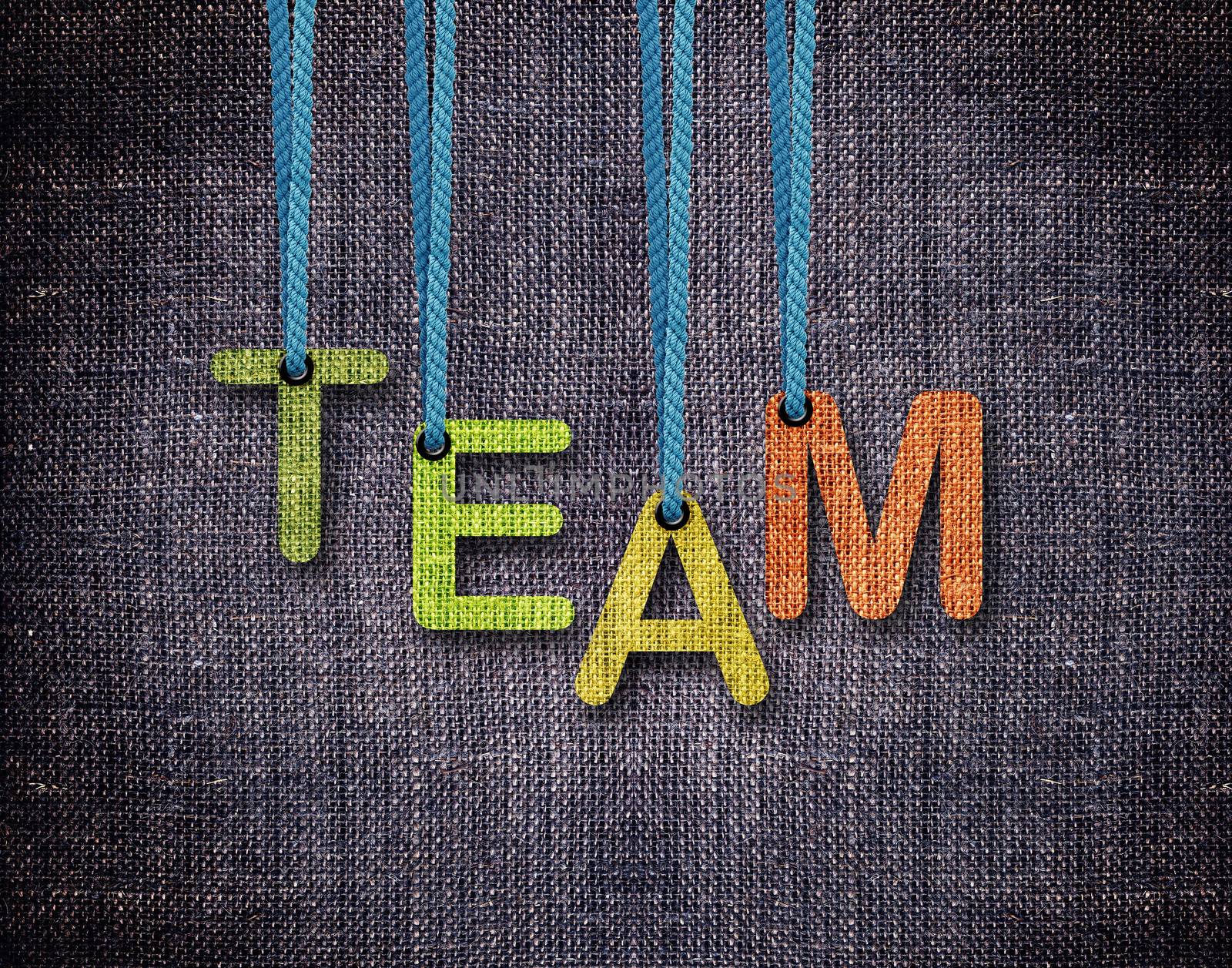 Team Letters hanging strings with blue sackcloth background.