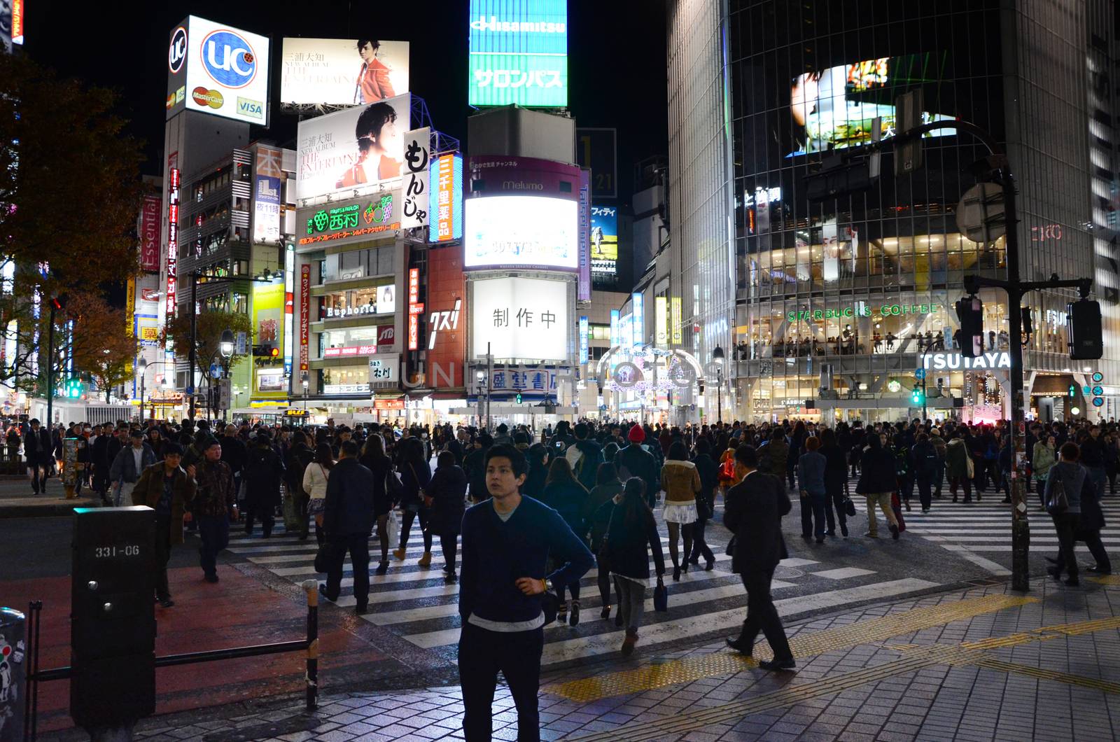 TOKYO - NOVEMBER 28: Pedestrians at the famed crossing of Shibuya by siraanamwong