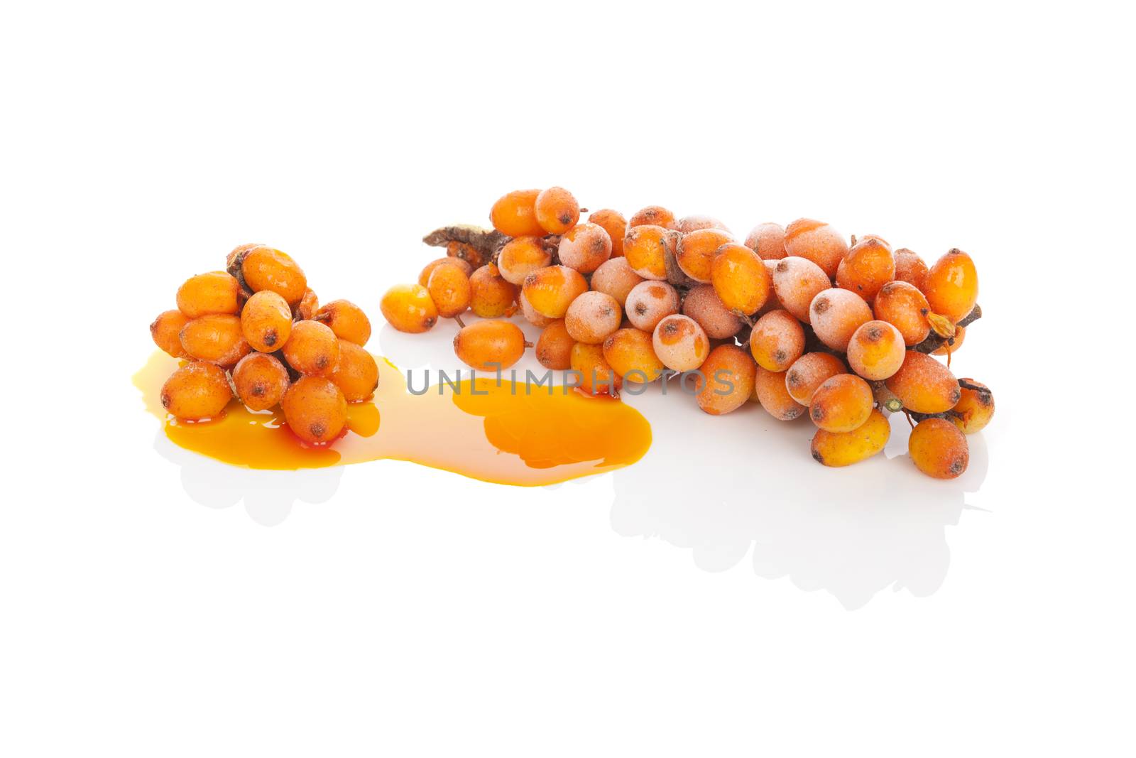 Sea buckthorn berries and sea buckthorn oil isolated on white background. Healthy fruit eating, natural detox.