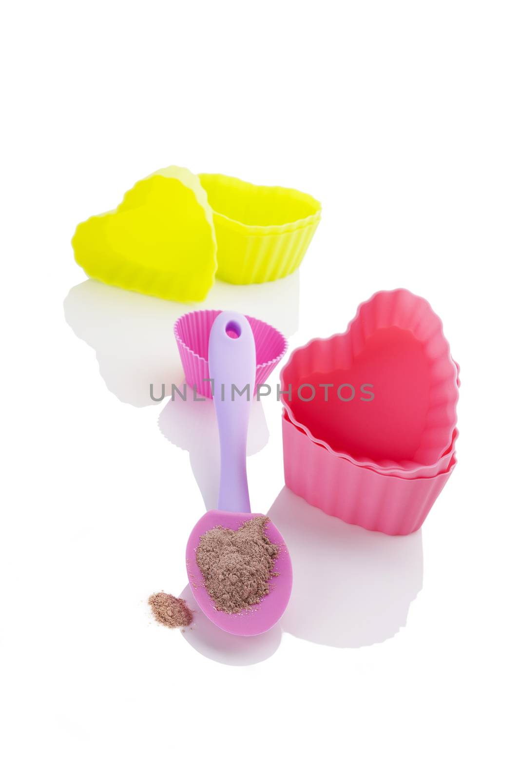 Contemporary baking forms with instant cookie mixture isolated on white background. Baking and cooking.