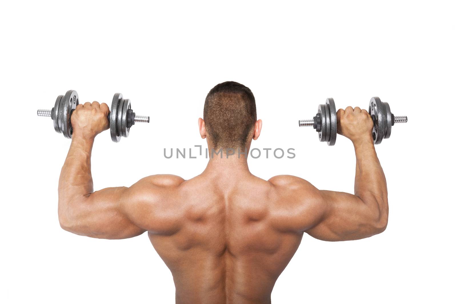 Sexy shirtless bodybuilder holding dumbbell, back view. Health, sports and fitness.