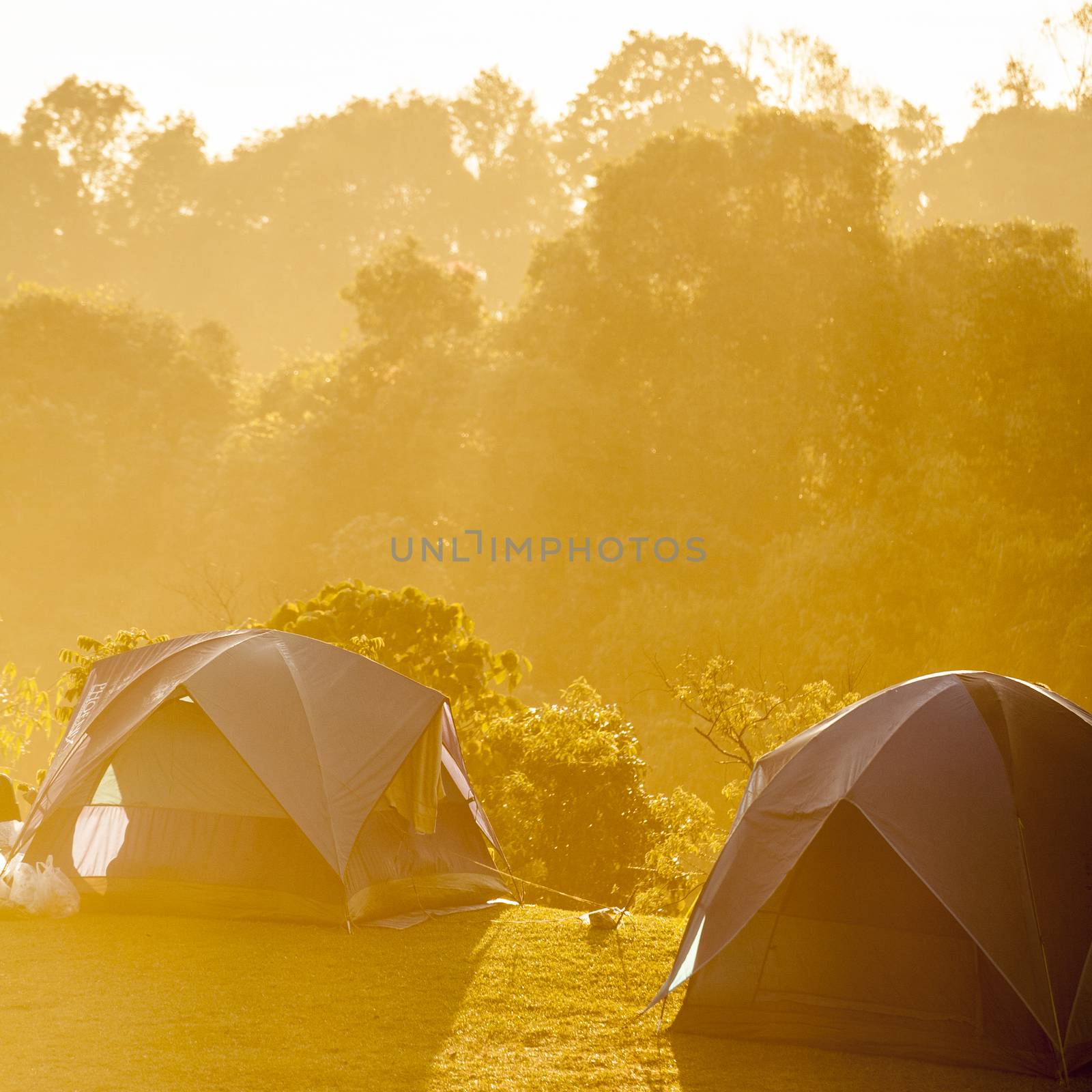 Camping tents on mountain morning by 2nix