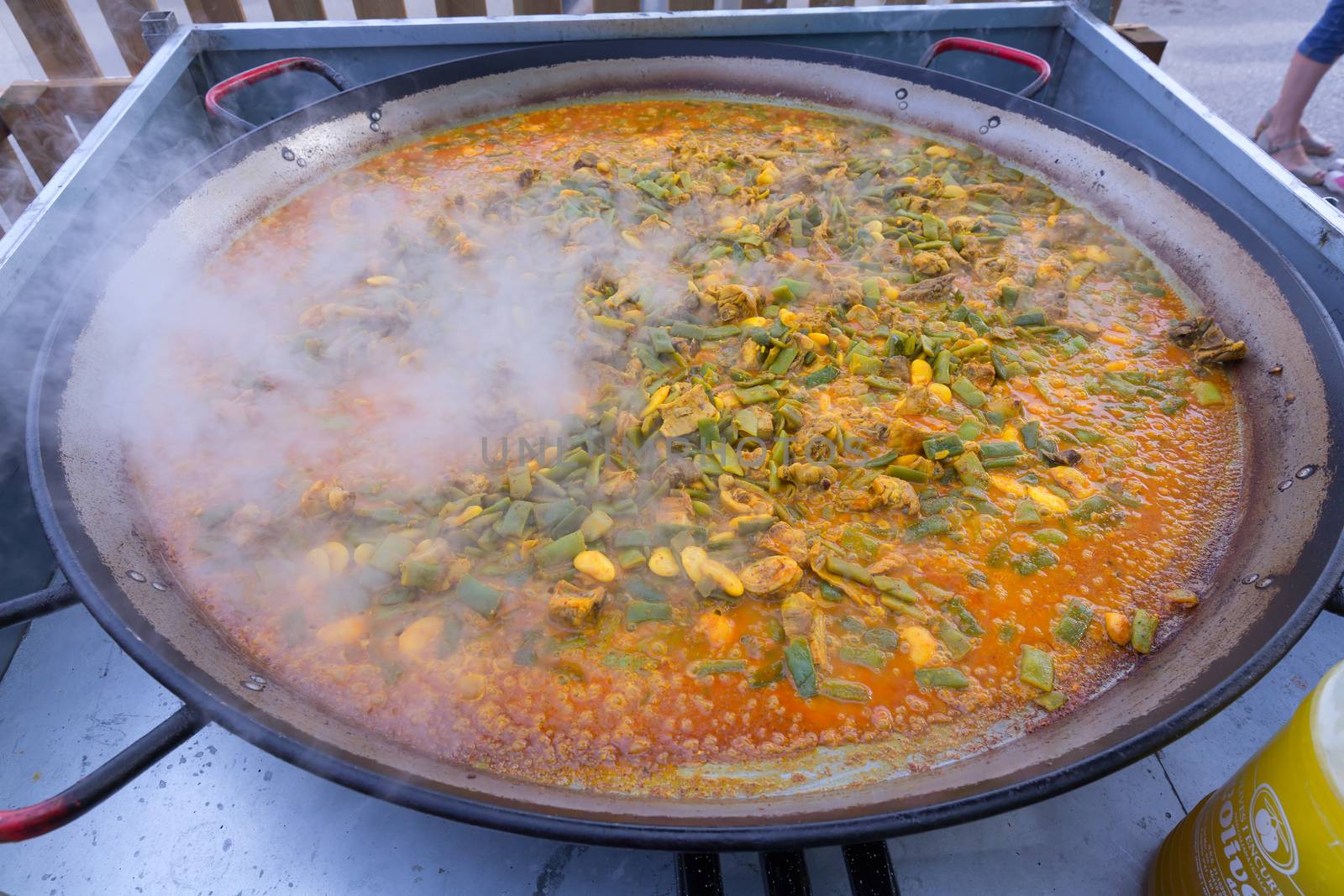 Cooking paella typical from Valencia Spain recipe with rice by lunamarina