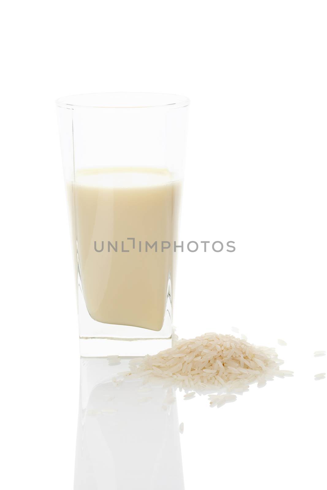 Rice milk in glass isolated on white background. Vegan and vegetarian milk concept.