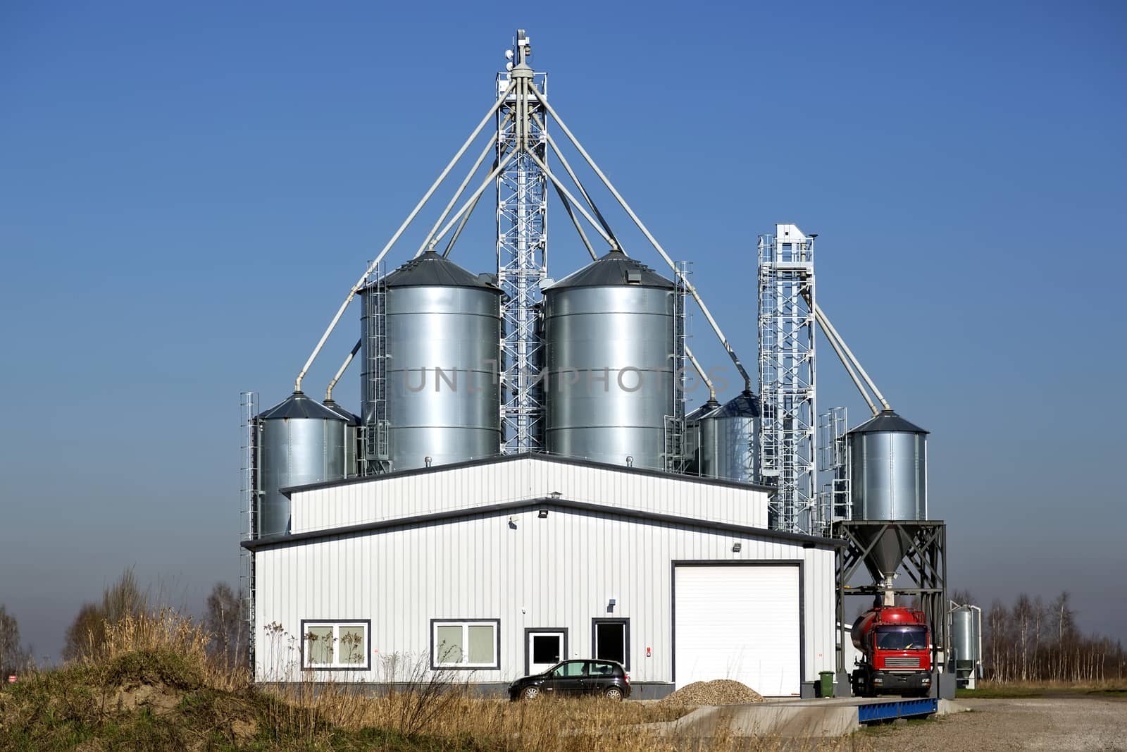 Storage of grain, in metal silos, on a blue sky