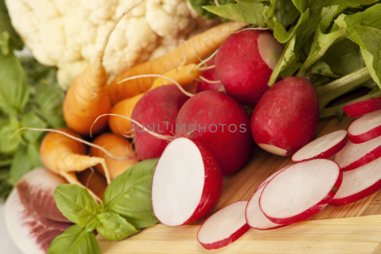 Organic vegetable carrots, cut radish, salad.