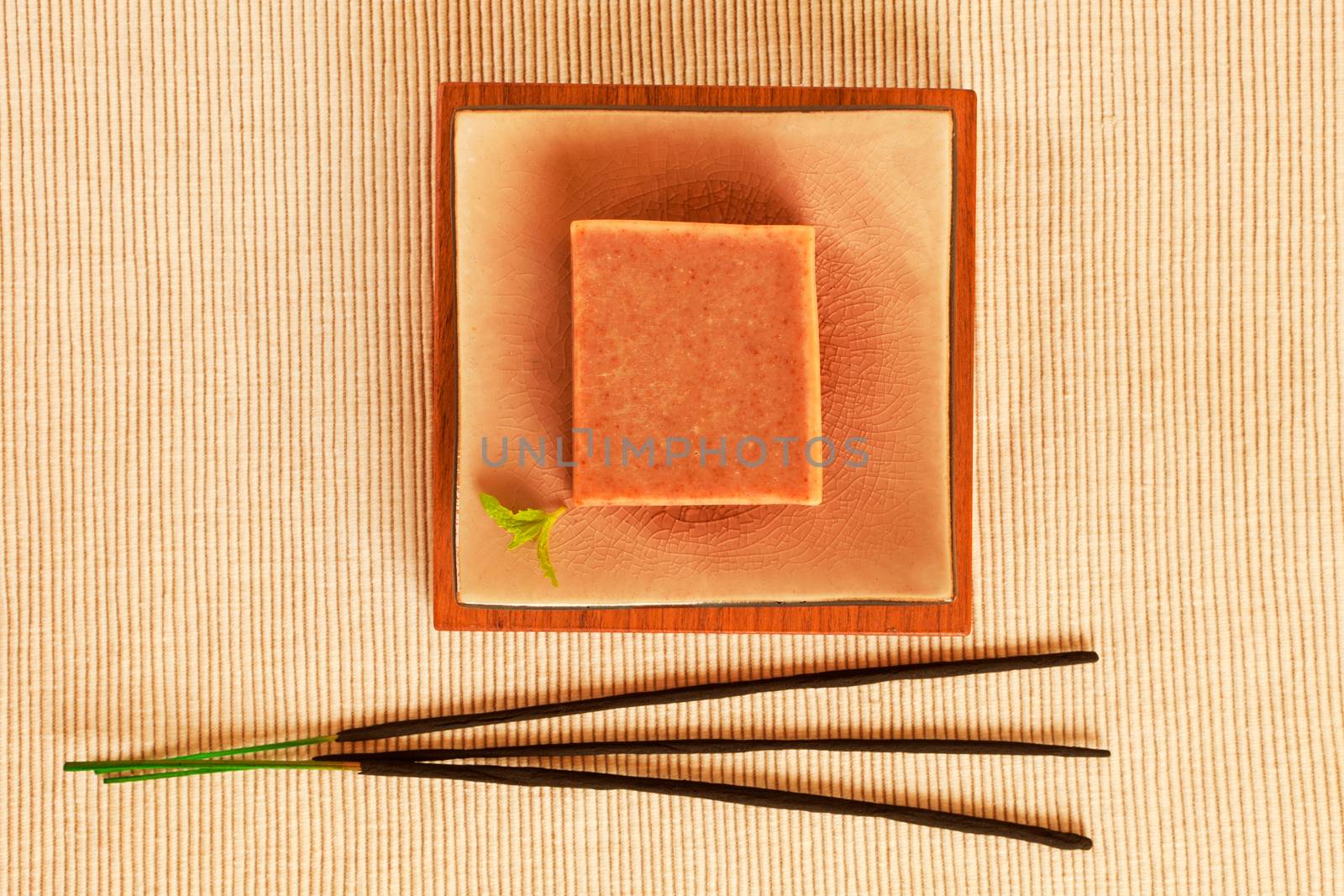 Wellness still life wiht soap bar and insence sticks.