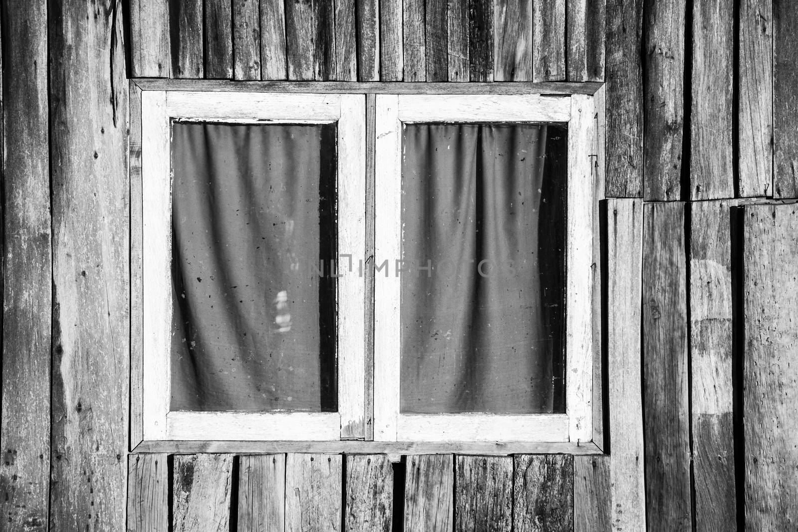 Texture of wooden wall with closed window