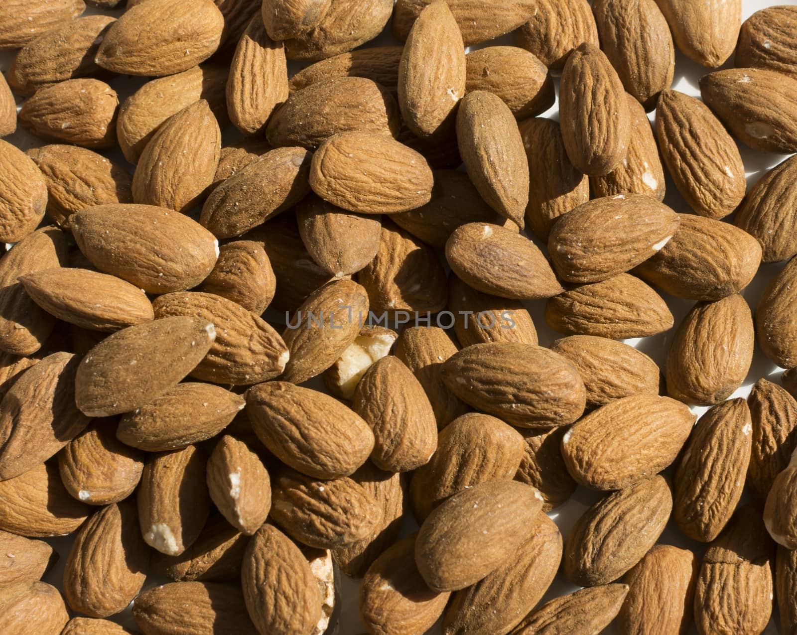 Raw almonds full frame by ArtesiaWells