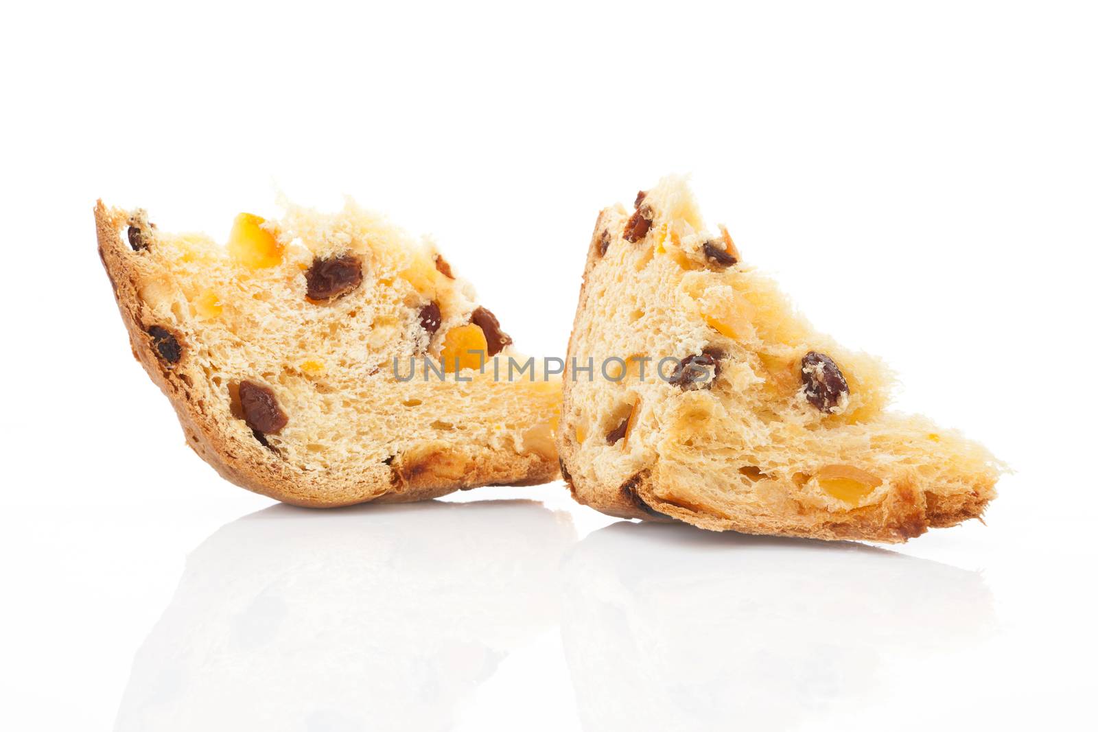 Two panettone pieces isolated on white background. Italian traditional festive christmas food.