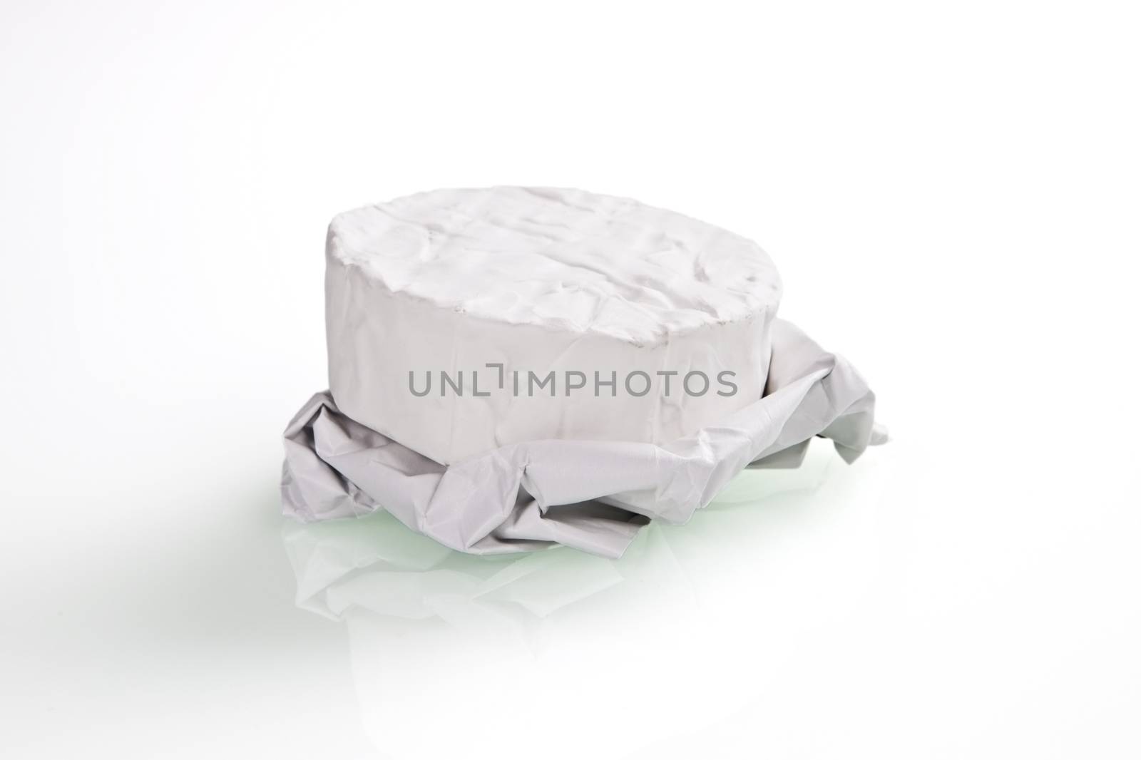 One white camembert cheese isolated on white background.