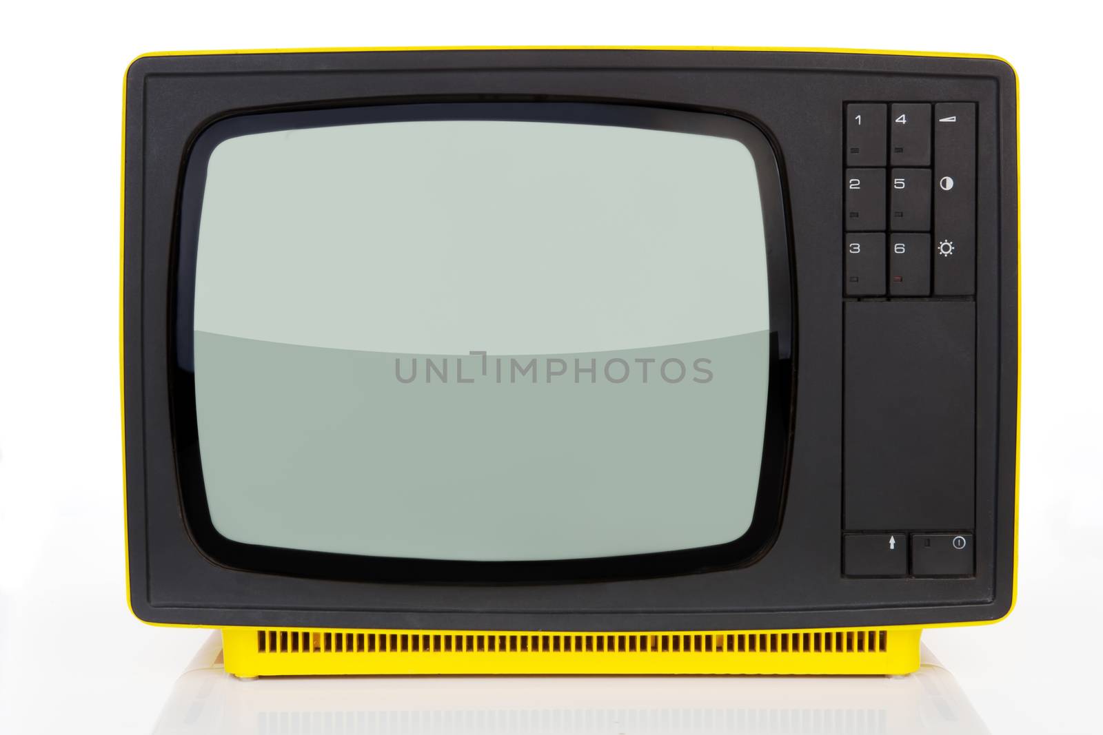Old yellow retro styled television from 1970's isolated on white background. Retro concept.