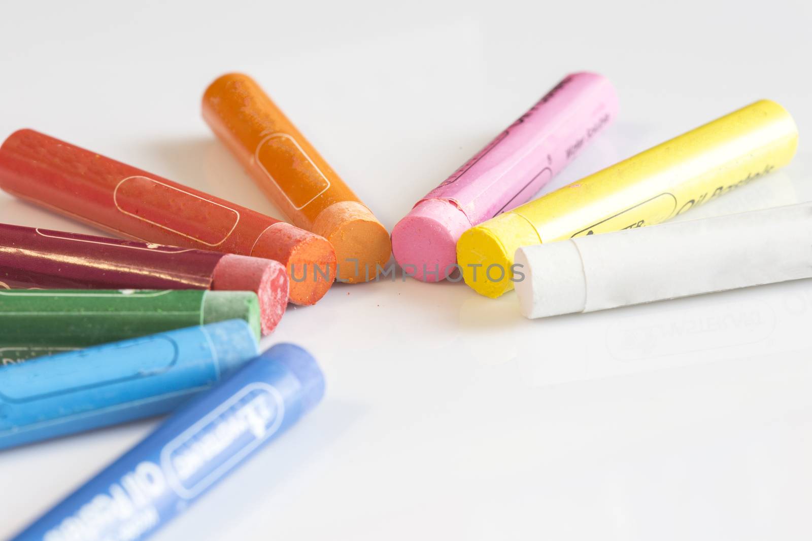 Crayons concept on white isolated background