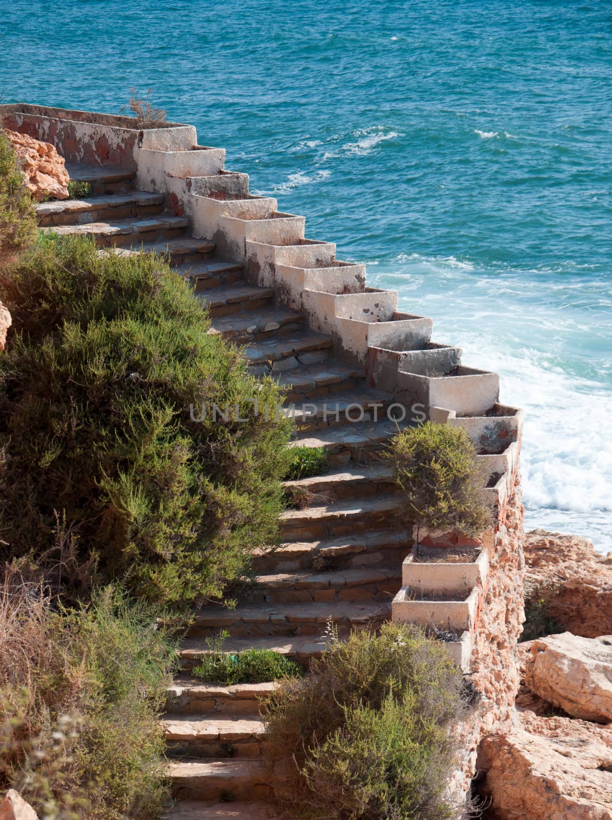 Stone staircase by the Mediterranean sea, close, La Zenia, Costa Blanca, Spain.