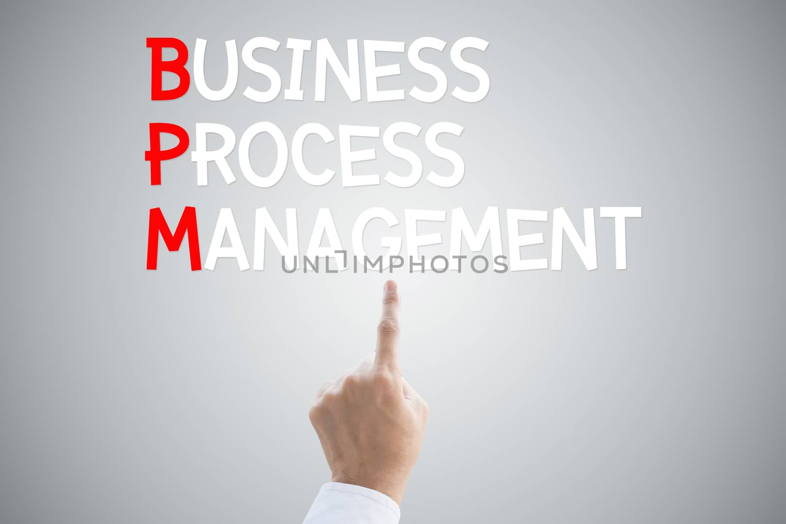 Business process management hand press concept on grey background