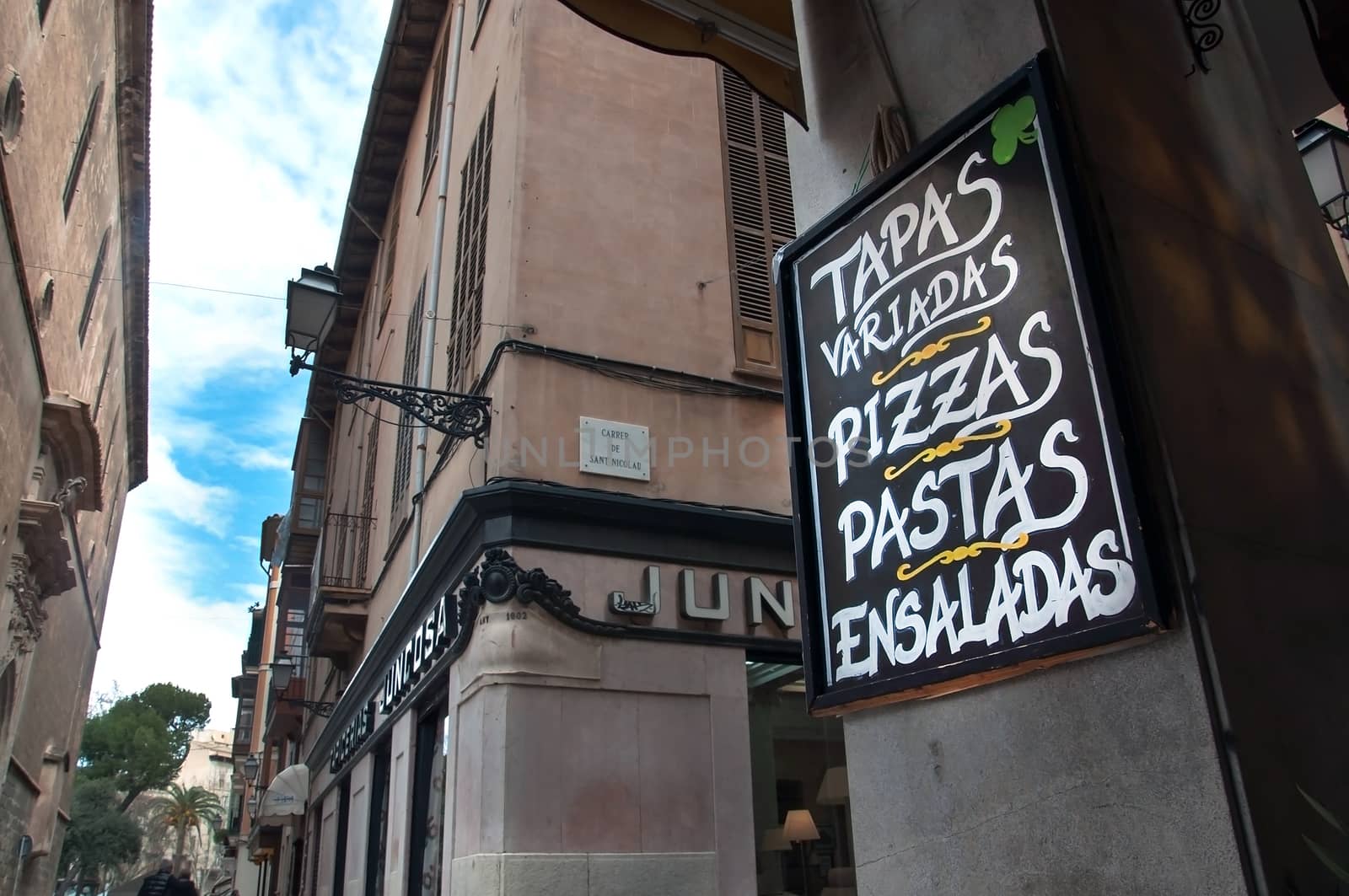 City view and an advertising text on chalkboard in a tapas bar in Palma de Mallorca, Balearic islands, Spain.