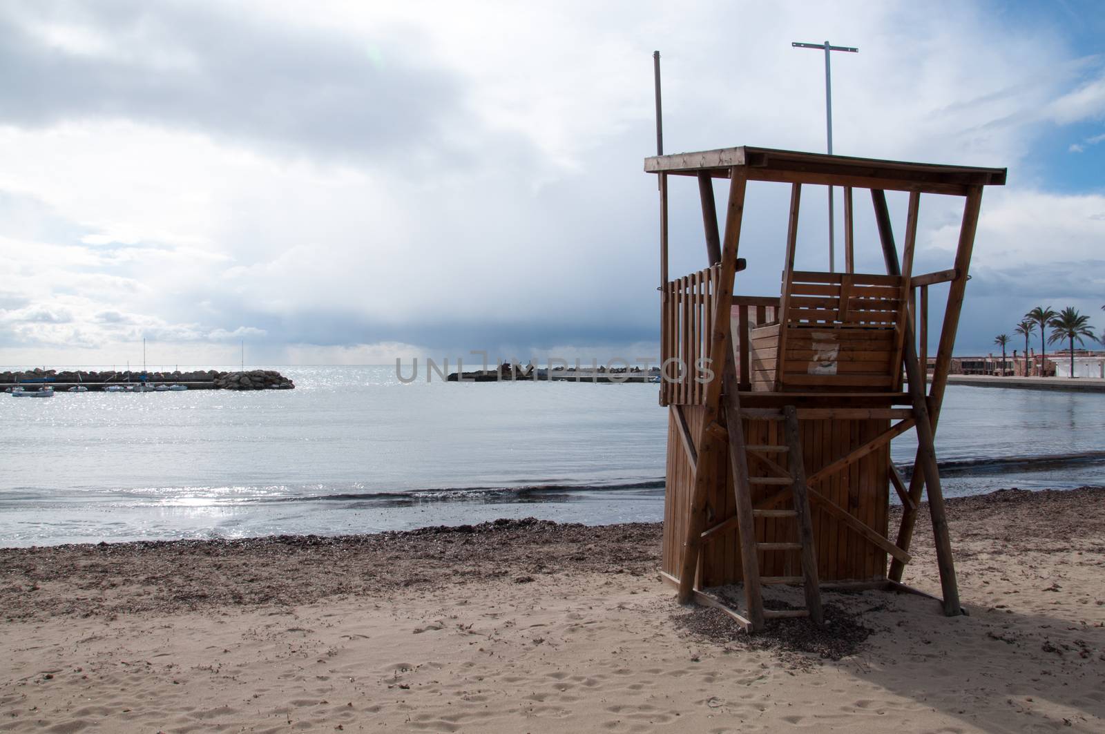 Life guard tower on empty beach by ArtesiaWells