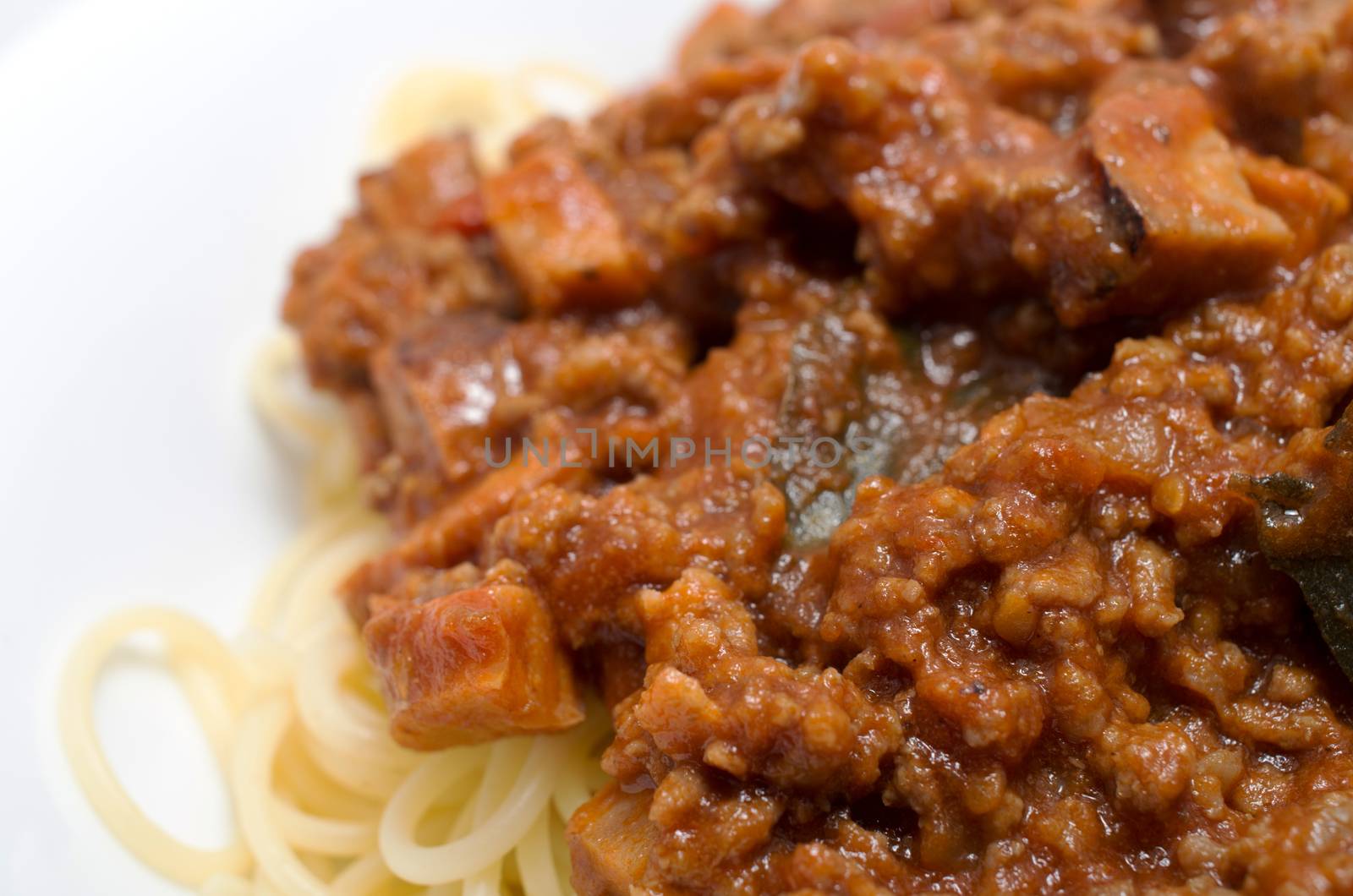 Closeup Spaghetti with a Bolognese and vegetable sauce.