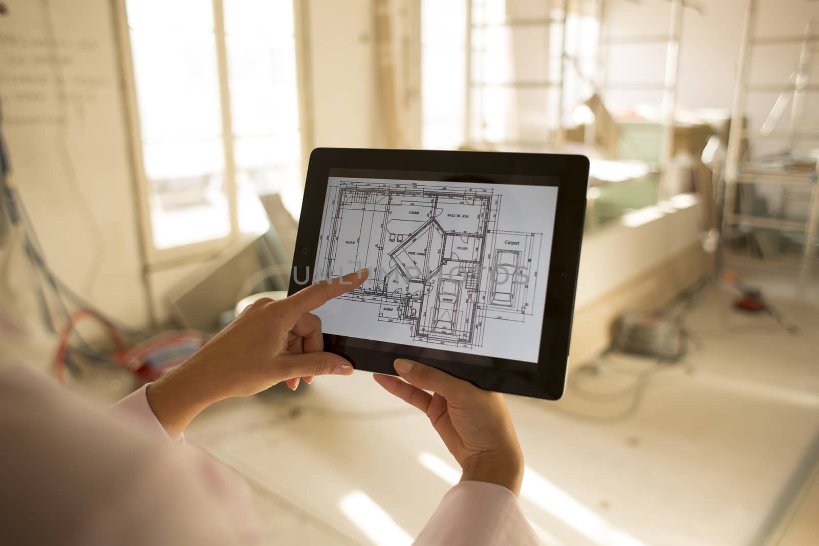 Architect woman working with electronic tablet by LDProd