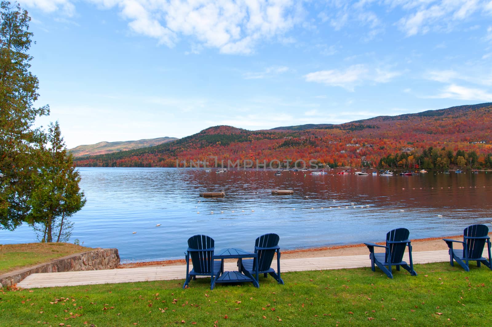 autumn landscape Mont Tremblant with benches facing the lake