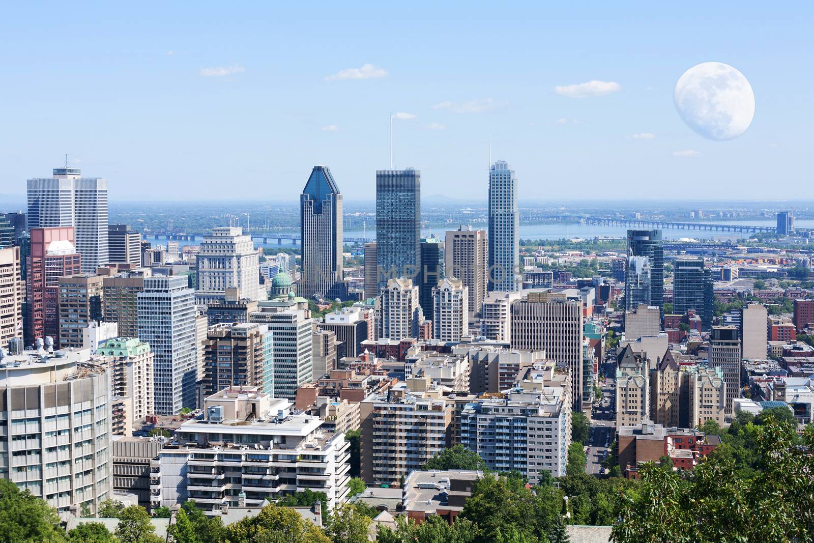 Montreal cityscape viewed from Mont-Royal with full moon 