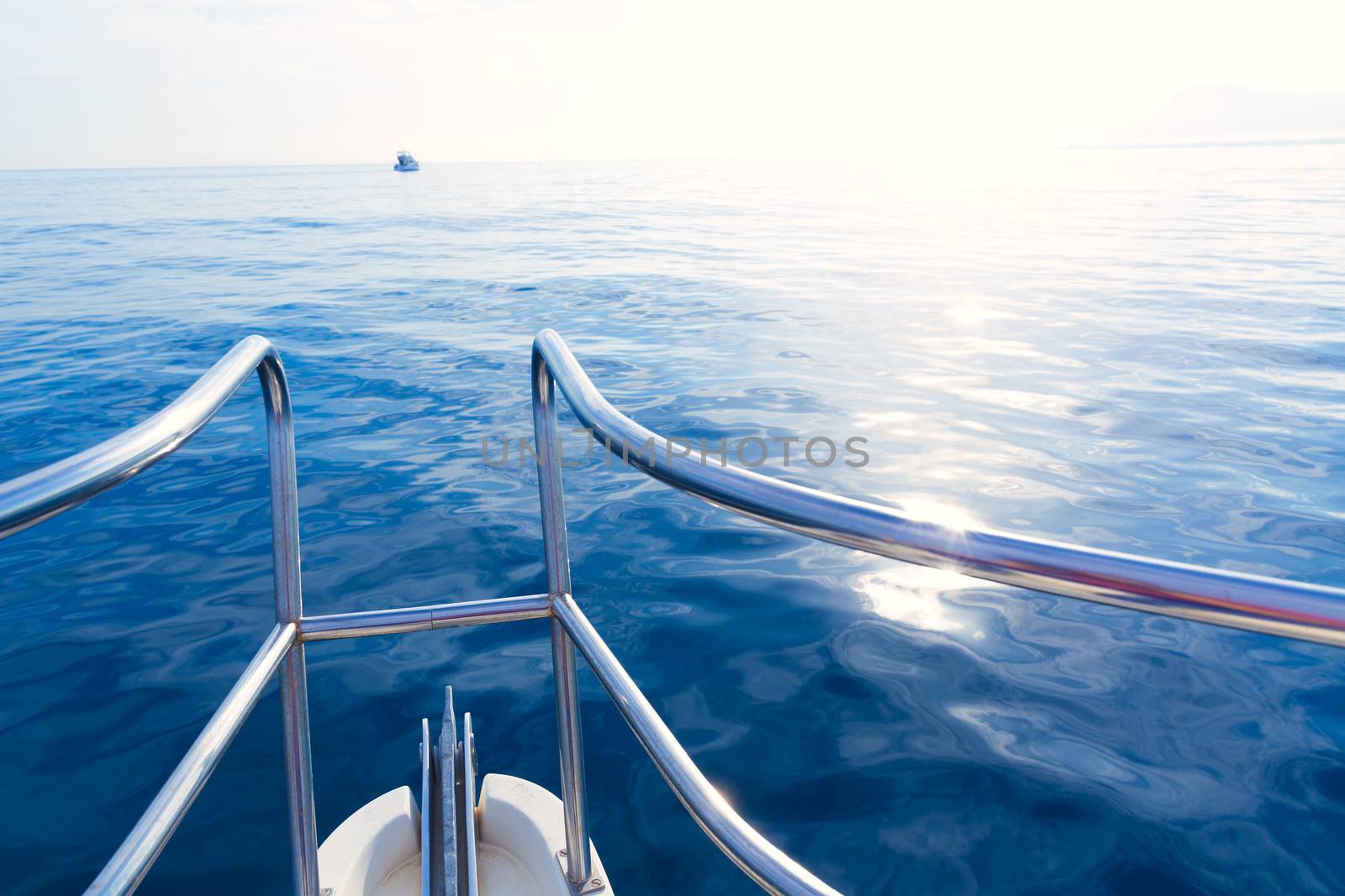 Boat bow sailing in blue calm sea ocean at blue Mediterranean